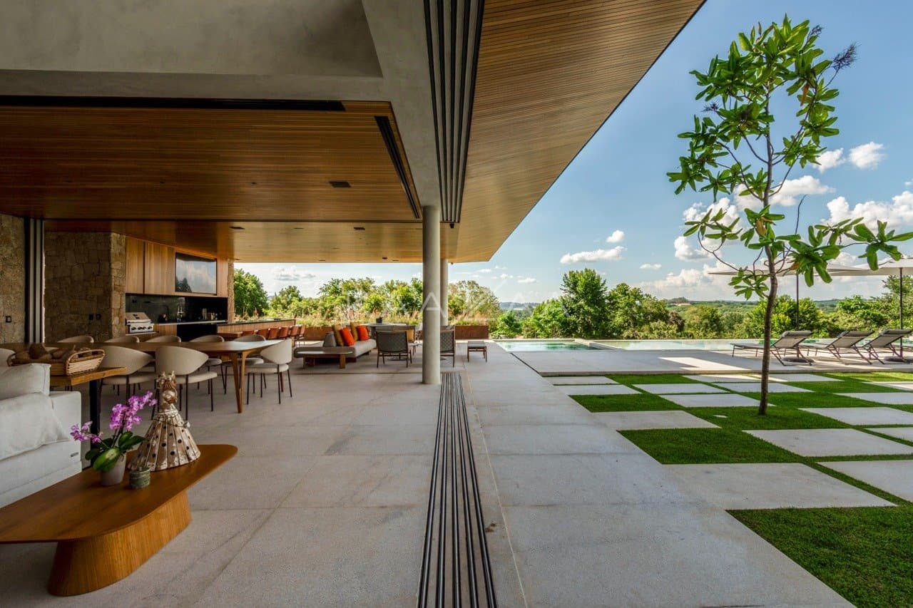 Casa contemporânea feita para interagir com a natureza ao redor. Projeto na Quinta da Baroneza. - Foto 13