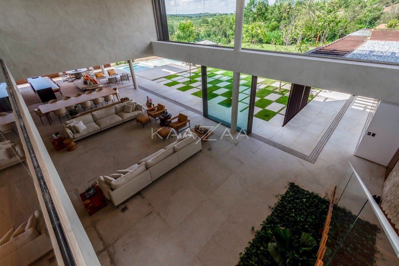 Casa contemporânea feita para interagir com a natureza ao redor. Projeto na Quinta da Baroneza. - Foto 34